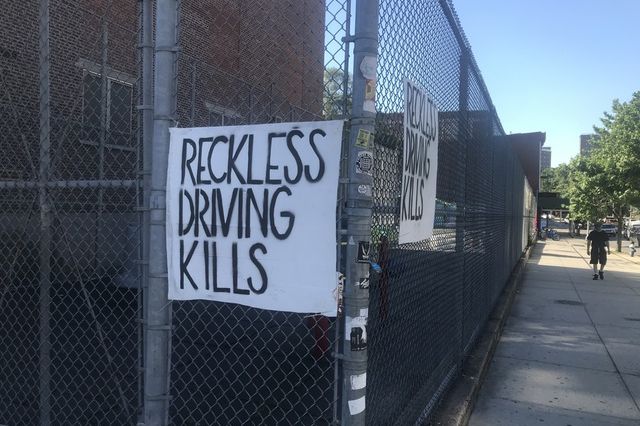 A sign at the intersection where Devra Freelander was struck and killed on Monday